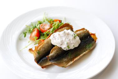 Smoked herring patties served with radish crème fraiche