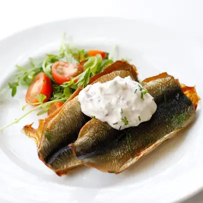 Smoked herring patties served with radish crème fraiche